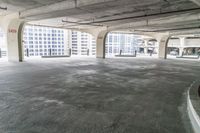 an empty parking garage with large windows and no floor to walk around the room, including a fire hydrant