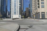 an empty street with some building next to it and traffic light on the right side