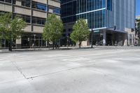 the empty streets are lined with tall buildings and people on bicycles are standing around the corner