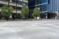 the empty streets are lined with tall buildings and people on bicycles are standing around the corner