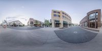 three fisheye lens images showing a street corner with people and buildings around it, one is at the end of the road, while another is on the other