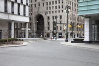 street view of city area with multiple buildings and streets corner in urban area in front