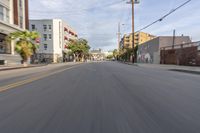 the street is empty as the car rides by on it's turnaround lane