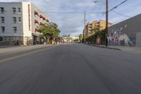 the street is empty as the car rides by on it's turnaround lane