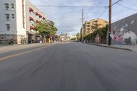 the street is empty as the car rides by on it's turnaround lane