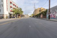 the street is empty as the car rides by on it's turnaround lane