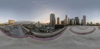 an amazing view of the downtown skyline from a skateboard ramp, taken with a fisheye lens