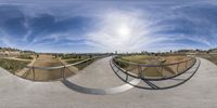 a 360 - view of the skate park that looks like it is in the middle of a city