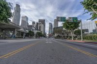 an empty street with multiple signs that say go ahead and bicycle path with buildings in the background