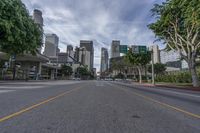 an empty street with multiple signs that say go ahead and bicycle path with buildings in the background