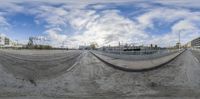 a fisheye view of the street from a bench top on a skateboard ramp