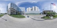 a 360 - view photo of a building with a flag flying in front of it