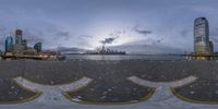 the fisheye photo is of a view of an old part of detroit city from the waterfront