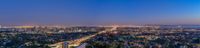 an aerial photo of the city lights of downtown san diego at night time with traffic driving along it