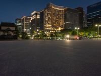 city street with a wide assortment of buildings in the background and cars moving through it