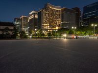 city street with a wide assortment of buildings in the background and cars moving through it