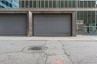 a metal garage door is left on the sidewalk by a fire hydrant and a stop sign