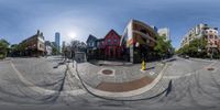 a big fish - eye lens picture is shown on the street in this panorama view