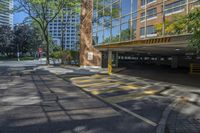 a car is in a parking lot with tall buildings near the curb in a city