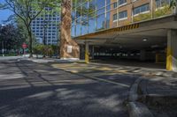 a car is in a parking lot with tall buildings near the curb in a city