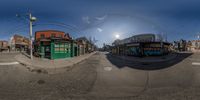 there is a fish eye view of a street scene with buildings on the side of it