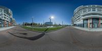 this is the view of an outdoor area in town taken from the street corner with a fisheye lens