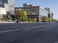 a city with a road and traffic light sitting in the middle of it next to buildings