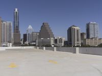 the view over the downtown area of a parking lot with an empty parking lot to the side