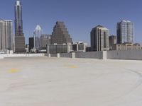 the view over the downtown area of a parking lot with an empty parking lot to the side