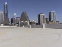 the view over the downtown area of a parking lot with an empty parking lot to the side