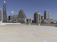 the view over the downtown area of a parking lot with an empty parking lot to the side