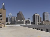 the view over the downtown area of a parking lot with an empty parking lot to the side