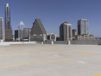 the view over the downtown area of a parking lot with an empty parking lot to the side