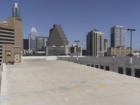 the view over the downtown area of a parking lot with an empty parking lot to the side