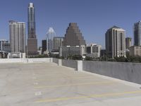 the view over the downtown area of a parking lot with an empty parking lot to the side