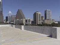 the view over the downtown area of a parking lot with an empty parking lot to the side