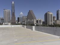 the view over the downtown area of a parking lot with an empty parking lot to the side