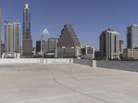 the view over the downtown area of a parking lot with an empty parking lot to the side