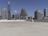 the view over the downtown area of a parking lot with an empty parking lot to the side
