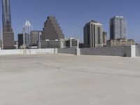 the view over the downtown area of a parking lot with an empty parking lot to the side