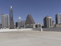 the view over the downtown area of a parking lot with an empty parking lot to the side