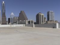 the view over the downtown area of a parking lot with an empty parking lot to the side