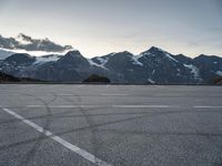 a snow covered mountain range with mountains in the distance and lines in the middle of it