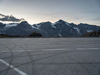 a snow covered mountain range with mountains in the distance and lines in the middle of it