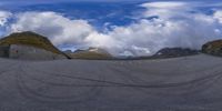 the view of the mountains through a fish eye lens lens with mountains in the background