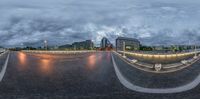 a 360 - view image of a large city street lit up in bright evening lights