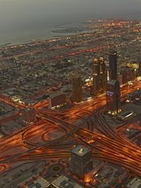 an aerial view of a city at night from above with all its streets and buildings