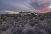 the sun is setting behind this desert house in arizona's mojave desert