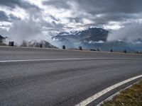 this is an image of a motorcyclist riding on the road on a cloudy day