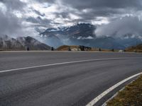 this is an image of a motorcyclist riding on the road on a cloudy day